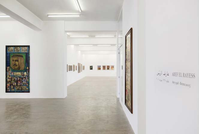 Gallery exhibition view with paintings hung on white walls